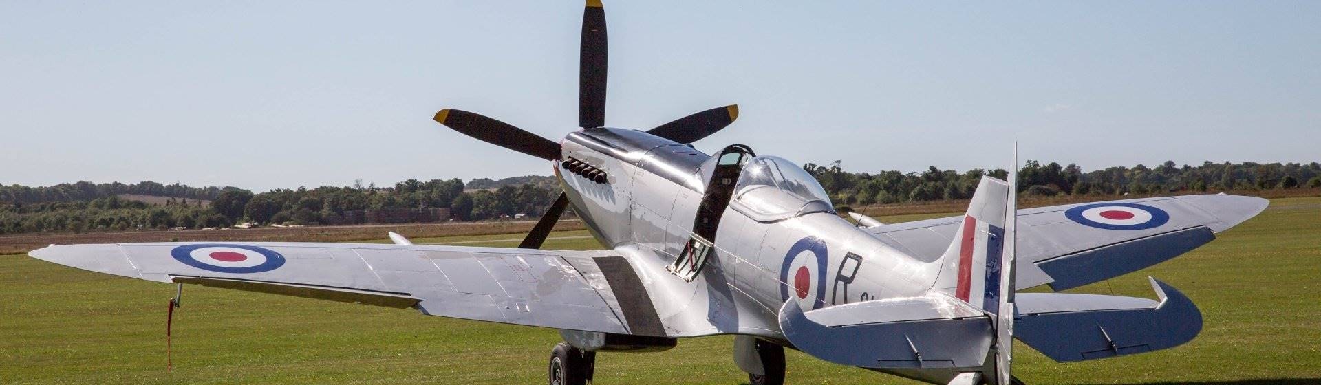 A Spitfire sitting waiting to perform at the Duxford air show